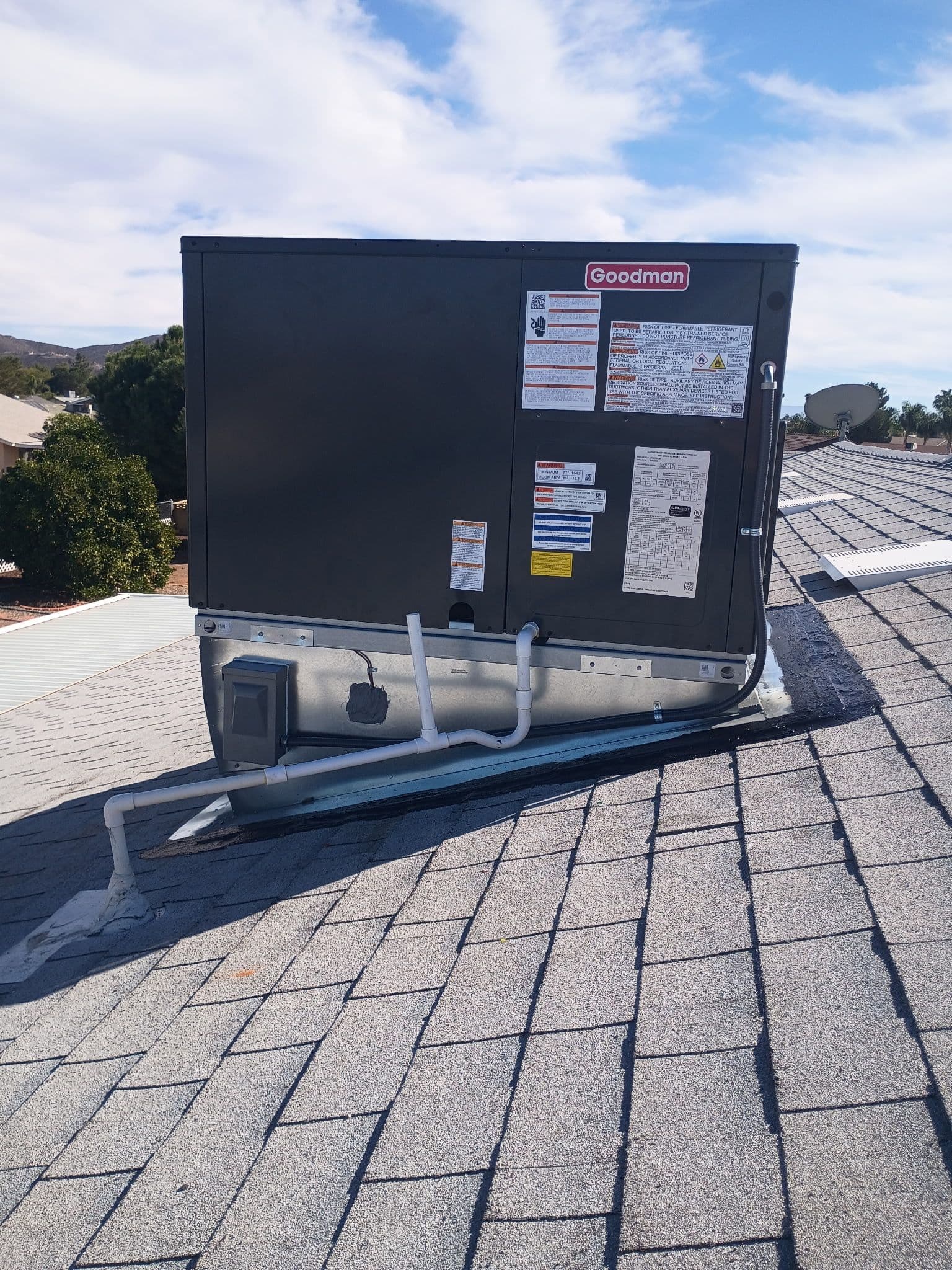Efficient A/C Installation: Goodman Unit on a Rooftop image